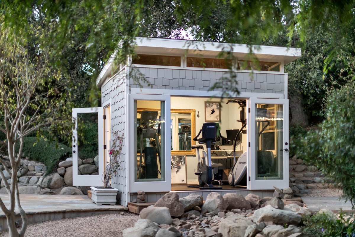 a modern shed with unique cedar shingle siding