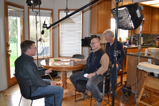 MSNBC producer Frank Silverstein, center, and MSNBC camera man Glenn Aust, at right, set up lighting and sound for Modern-Shed GM Tim Vack's interview.