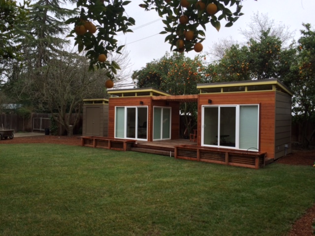 Jim and his wife actually have three Modern-Sheds -- a smaller 6' by 8' garden shed sits to the left of the twin studios.