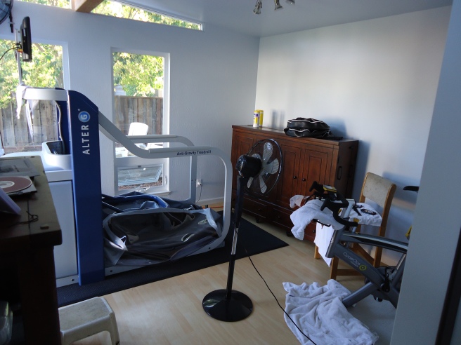 Amol's fitness equipment dominates the room, but notice the fan and television!